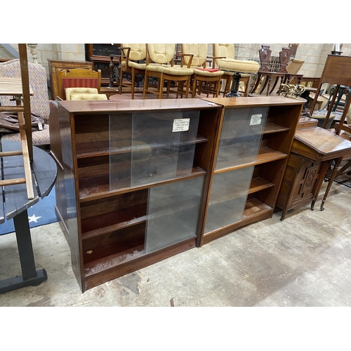 18 - A near pair of mid century bookcases by Herbert E Gibbs, larger width 91cm, depth 24cm, height 112cm... 