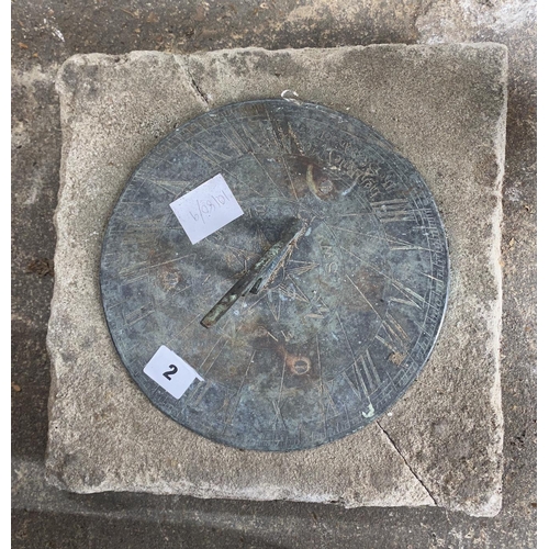2 - A circular metal and reconstituted stone sun dial, width 30cm