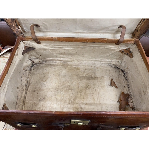 32 - A Victorian leather brass and copper studded travelling trunk, width 89cm, depth 53cm, height 37cm... 