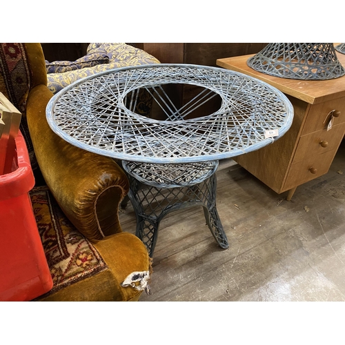 50 - A painted wrought iron circular garden table, by Russell Woodard, diameter 88cm, height 70cm (lackin... 
