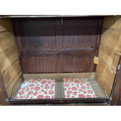 7 - A George III mahogany linen press, width 134cm, depth 60cm, height 204cm