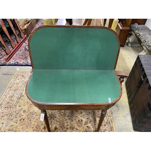 1040 - A Regency ebony inlaid mahogany D shaped folding card table, width 92cm, depth 46cm, height 73cm... 
