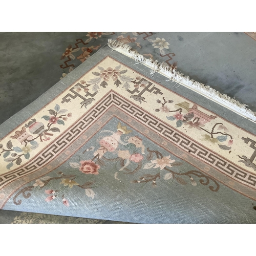 1058 - A Chinese celadon ground floral carpet, 370 x 272cm