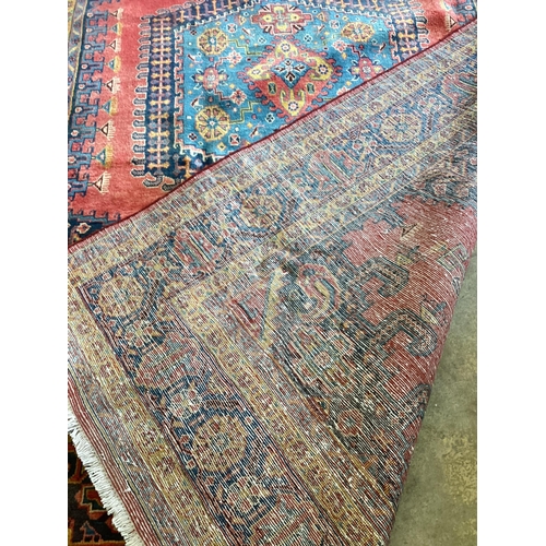 1068 - A Veis red ground carpet, 320 x 200cm