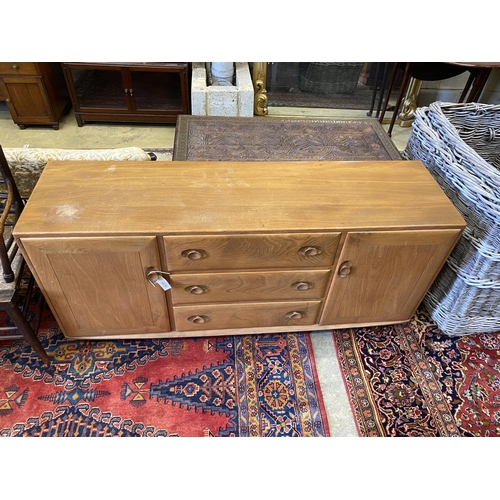 1070 - An Ercol light elm sideboard, length 155cm, depth 43cm, height 68cm