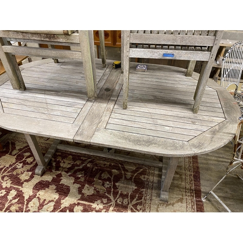 1078 - A Lindsey weathered teak garden table, length 190cm, width 110cm, height 74cm and four stacking elbo... 