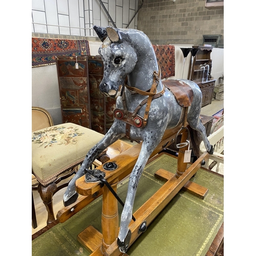 1093 - A G&J Lines type rocking horse on beech safety frame (later painted), length 112cm, height 97cm... 