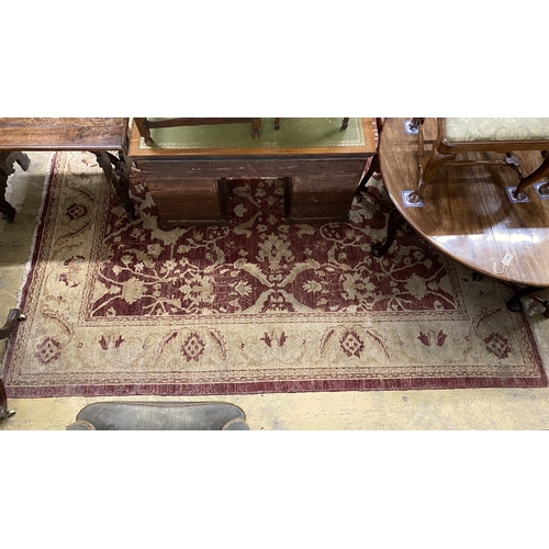 1118 - A Zeigler style burgundy ground carpet, 306 x 245cm