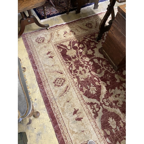1118 - A Zeigler style burgundy ground carpet, 306 x 245cm