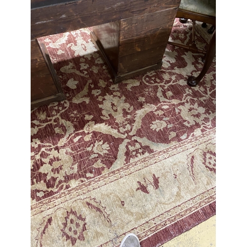 1118 - A Zeigler style burgundy ground carpet, 306 x 245cm