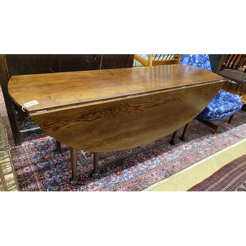 101 - A reproduction 18th century style oak drop leaf wake table, length 196cm, width 153cm extended, heig... 