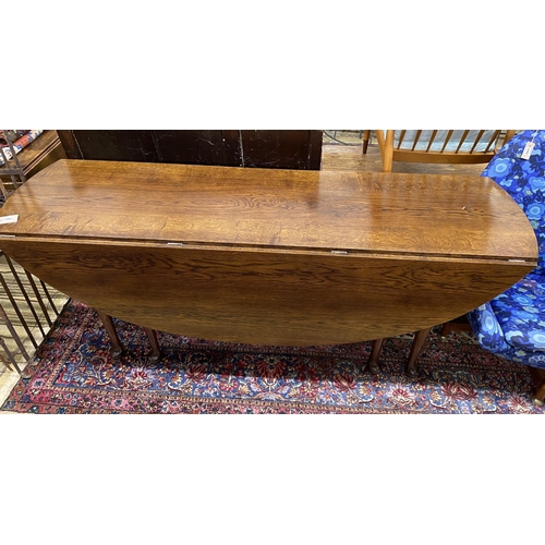 101 - A reproduction 18th century style oak drop leaf wake table, length 196cm, width 153cm extended, heig... 