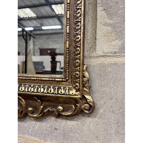 120 - A George II giltwood mirror, later plate, width 45cm, height 80cm