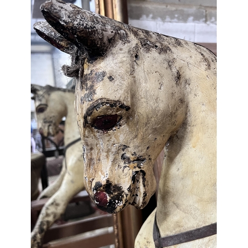 132 - An early 20th century rocking horse on pine safety frame, length 152cm, height 98cm