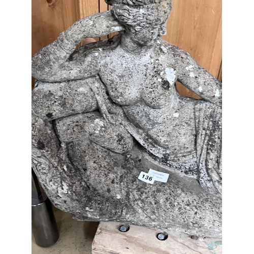 136 - A reconstituted stone reclining female garden ornament, length 90cm, height 50cm