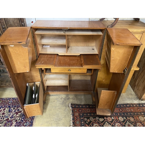 139 - A mid century teak 'magic box' enclosed desk, width 85cm, depth 54cm, height 114cm