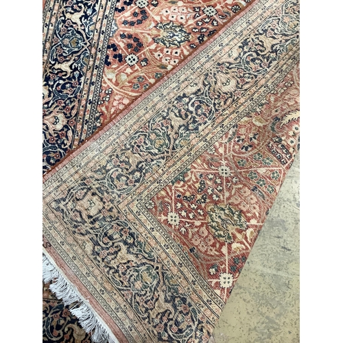 146 - A North West Persian red ground rug, 220 x 137cm