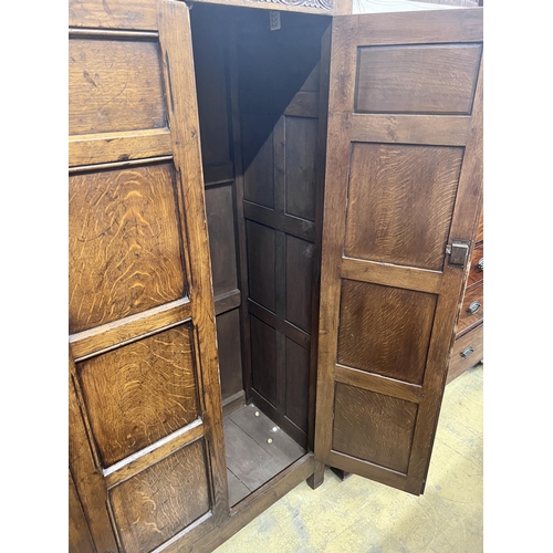 16 - An 18th century style panelled oak hanging cupboard, width 96cm, depth 53cm, height 178cm