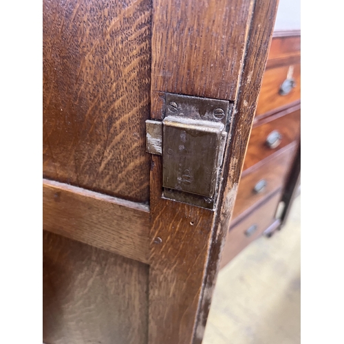 16 - An 18th century style panelled oak hanging cupboard, width 96cm, depth 53cm, height 178cm