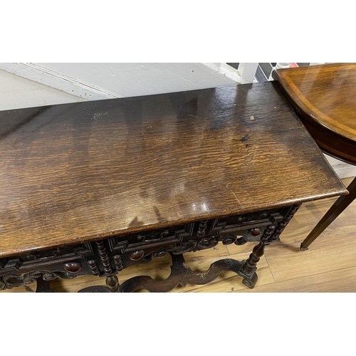 160 - A small Jacobean revival oak two drawer serving table, width 128cm, depth 46cm, height 72cm