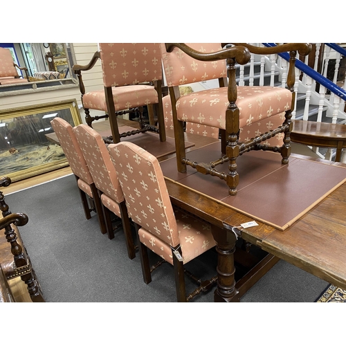 162 - A set of eight 18th century style oak dining chairs with fleur de lys upholstery, two with arms... 