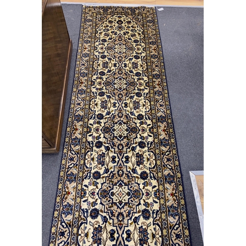 166 - A North West Persian ivory ground runner, 400 x90cm