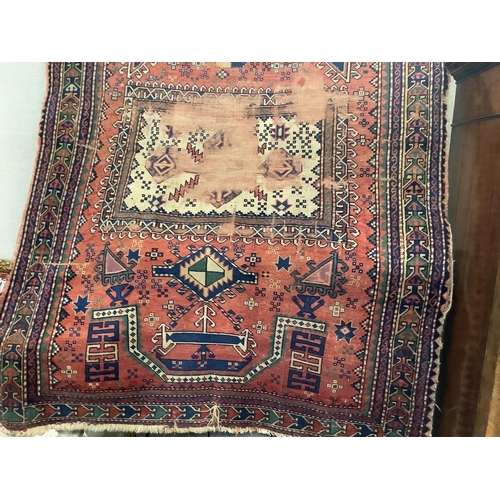 17 - An antique Kazak red ground prayer rug180cm x 135cm.