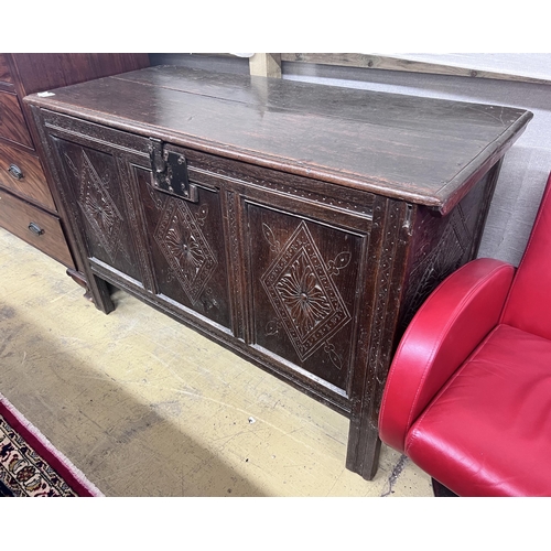 19 - An 18th century carved oak coffer, length 133cm, depth 57cm, height 83cm