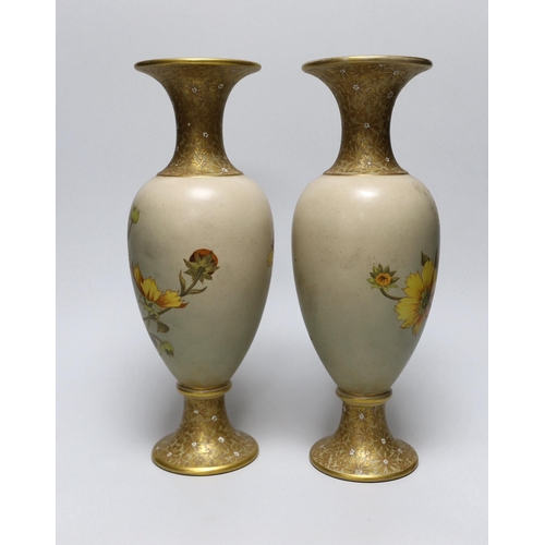 258 - A pair of Royal Doulton earthenware vases, each stamped to the base, 31cm high