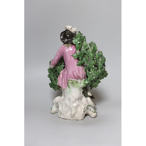 261 - An 18th century Derby figure of a seated gentleman, 1760s, 24cm high