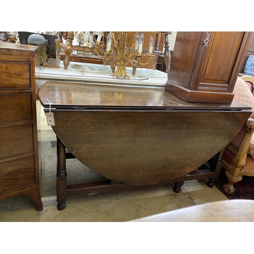 27 - An 18th century oak gateleg table, width 148cm, depth 55cm, height 73cm