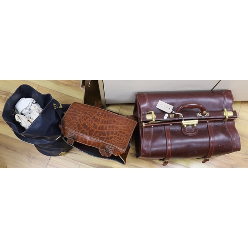 287 - An ox-blood leather Gladstone bag, 43cm, a faux crocodile bag and one other