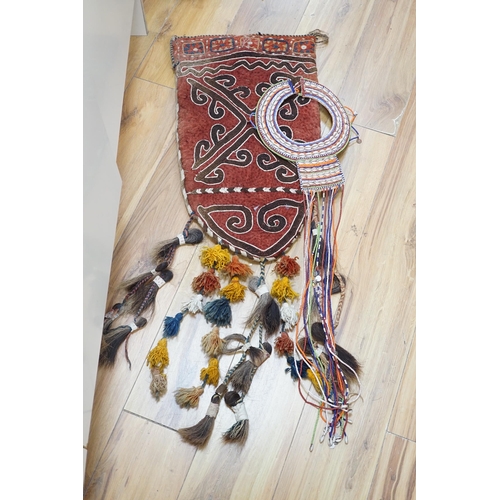 289 - An African tribal bead and shell work necklace together with an embroidered Uzbek saddle bag with ta... 