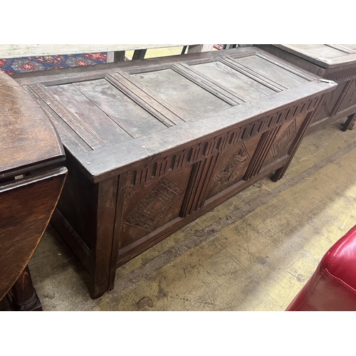 29 - An 18th century carved oak coffer, length 142cm, depth 55cm, height 62cm