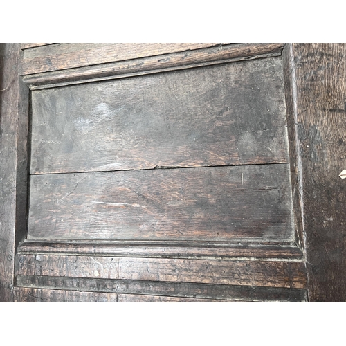 29 - An 18th century carved oak coffer, length 142cm, depth 55cm, height 62cm