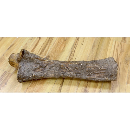 293 - An unusual Benin-style carved elephant femur, Nigeria, 73cm high