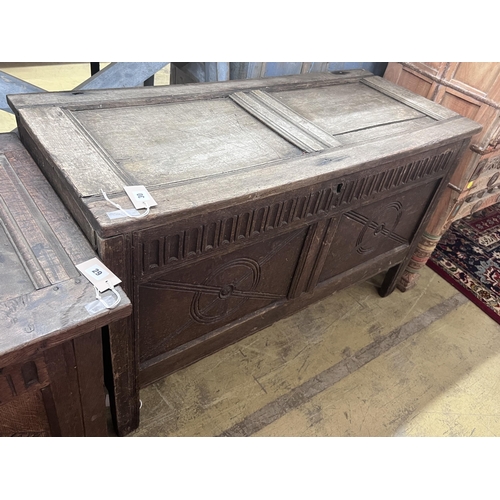 30 - An 18th century carved oak coffer, length 114cm, depth 48cm, height 69cm