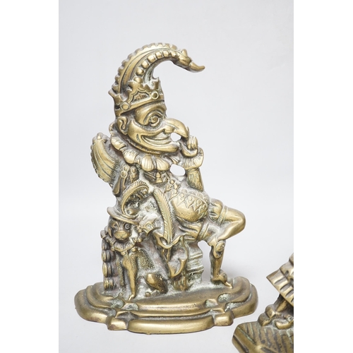 301 - A pair of cast brass Punch and Judy door-stops, the largest 28cm high