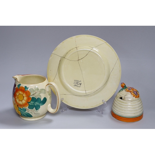 306 - An early Clarice Cliff Fantasque plate, a Clarice Cliff honey pot and a Gray's jug, a.f.