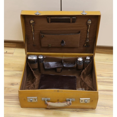 307 - A vintage Mappin and Webb vanity case with five silver mounted bottles, 51cm wide