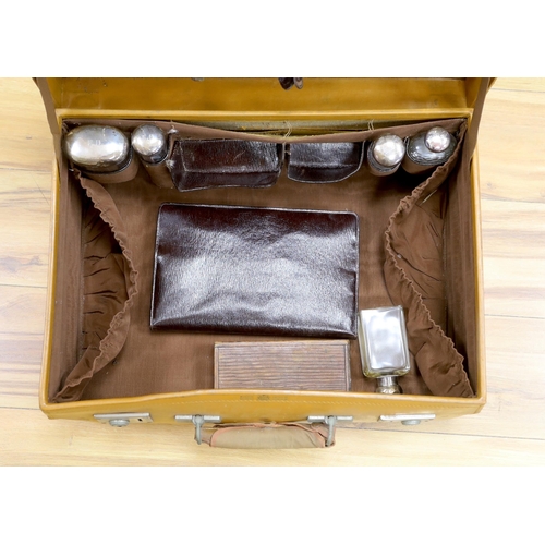 307 - A vintage Mappin and Webb vanity case with five silver mounted bottles, 51cm wide