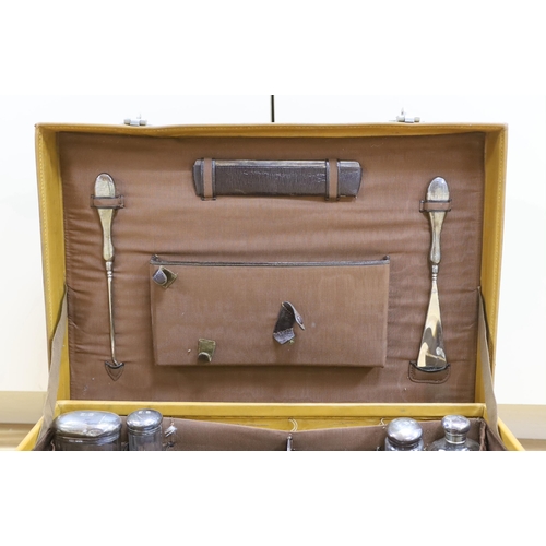 307 - A vintage Mappin and Webb vanity case with five silver mounted bottles, 51cm wide