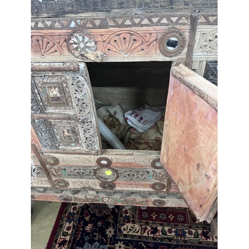 31 - An Indian painted carved hardwood cabinet, width 124cm, depth 43cm, height 125cm