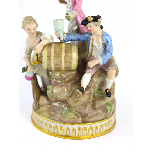 329 - A Meissen group of grape pickers with barrels of wine, 19th century, modelled on a rockwork and tree... 