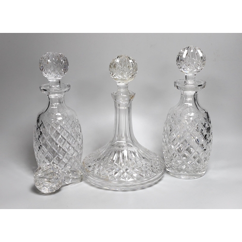 338 - A pair of Waterford Colleen pattern decanters, a ships decanter a and four stoppers