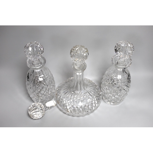 338 - A pair of Waterford Colleen pattern decanters, a ships decanter a and four stoppers