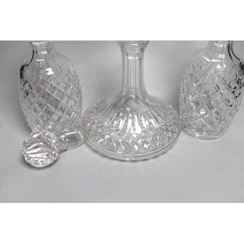 338 - A pair of Waterford Colleen pattern decanters, a ships decanter a and four stoppers