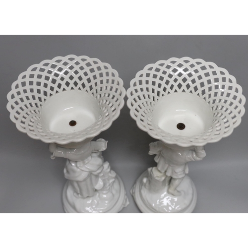 361 - A pair of Paris porcelain figural comports or centre pieces with lattice work baskets, each 38cm hig... 