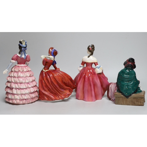 369 - Four Royal Doulton figurines including Autumn Breezes and an oversized Christian Dior advertising sc... 