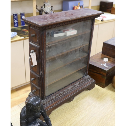 373 - A glazed and carved mahogany cigarette shop display cabinet with remnants of gold lettering to the f... 